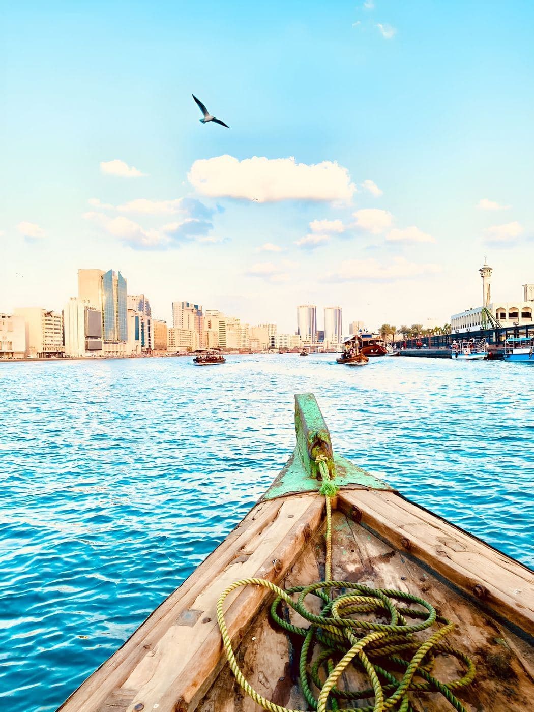 Travellers crossing Dubai Creek on a traditional abra